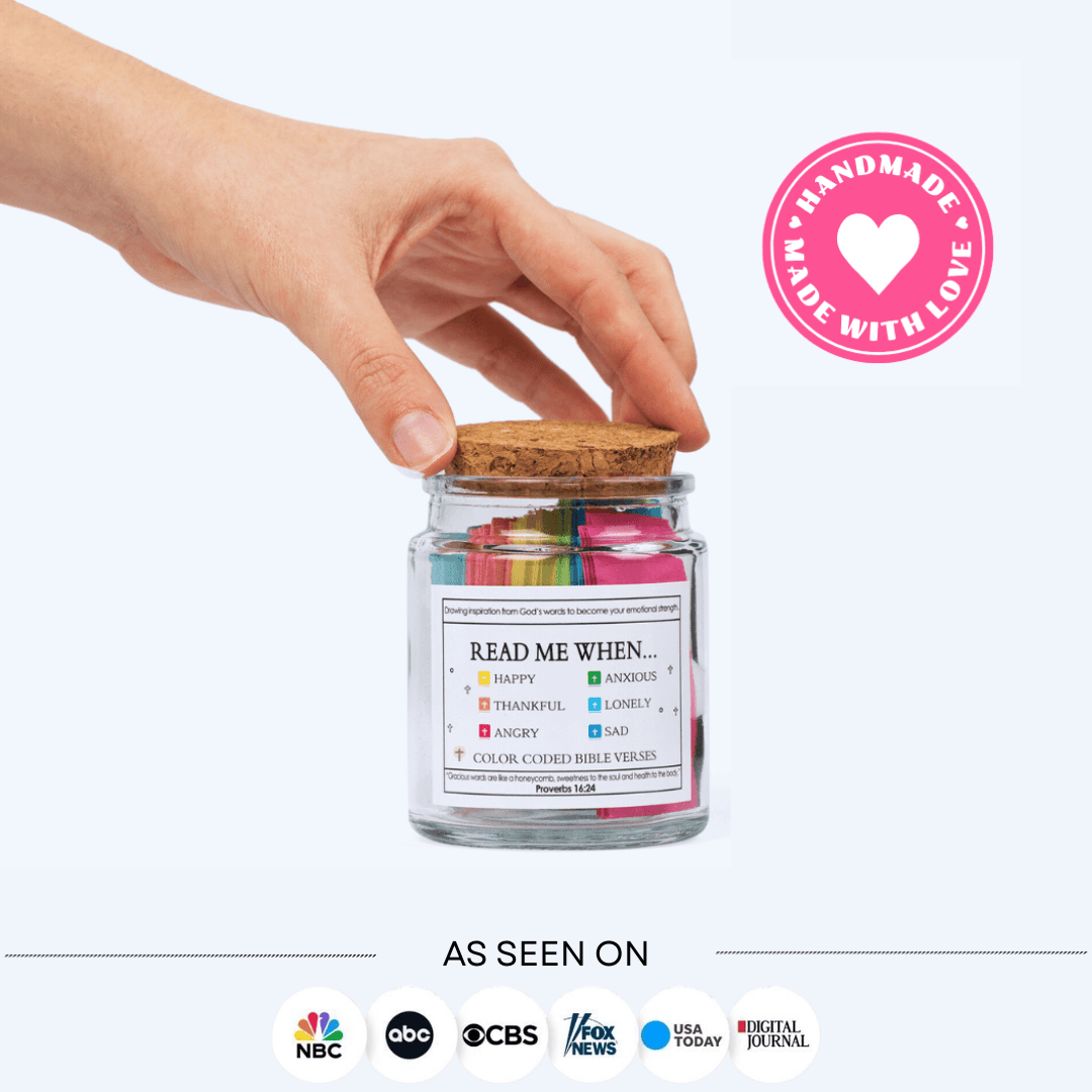 Hand picking a color-coded scripture from the Bible Verse Jar for daily encouragement